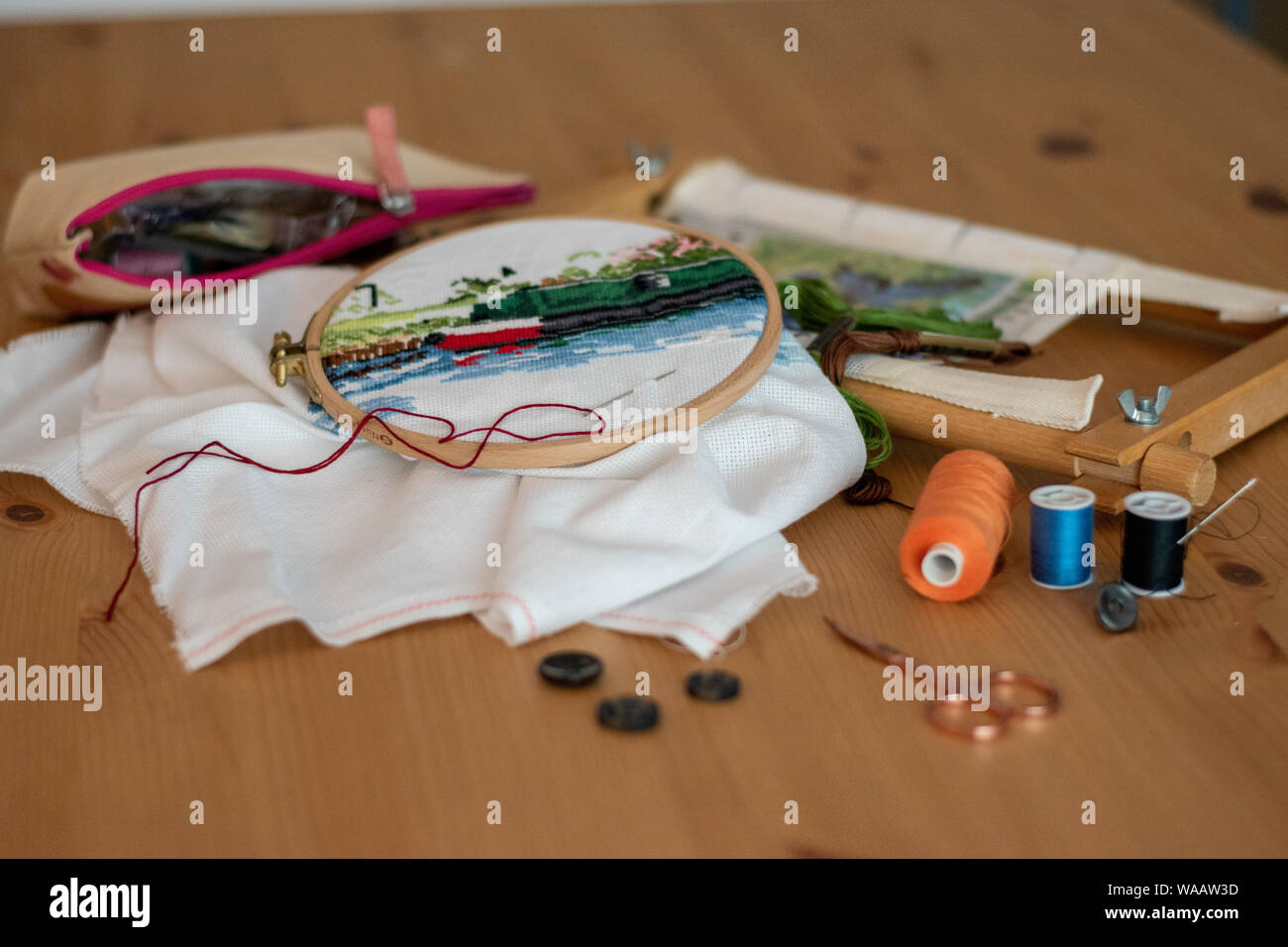 Crossstitch embroidery materials, including threads, needles, scissors