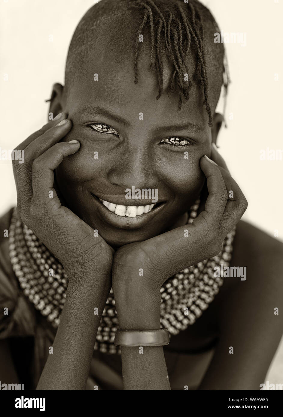 Beautiful Turkana tribal girl with traditional necklace and headdress in Loyangalani, Kenya. Stock Photo