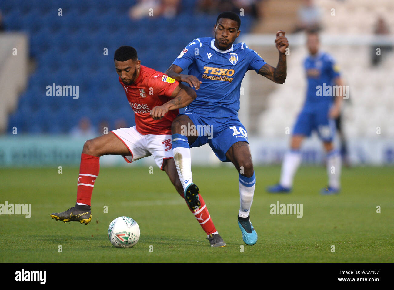Jevani Brown of Colchester United does battle with Keshi Anderson of Swindon Town - Colchester United v Swindon Town, Carabao Cup, JobServe Community Stadium, Colchester, UK - 13th August 2019  Editorial Use Only - DataCo restrictions apply Stock Photo