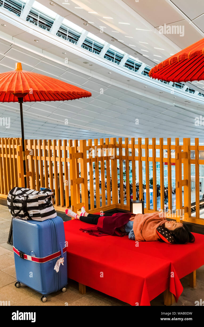 Japan, Honshu, Tokyo, Haneda Airport, International Terminal, Departure Area, Sleeping Passenger