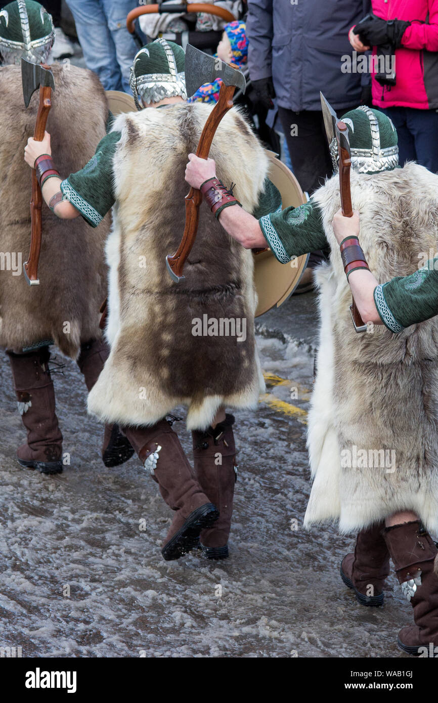 The 2019 Up Helly Aa festival featuring the Guizer Jarl Squad daytime procession through Lerwick on an icy winter's day in January Stock Photo