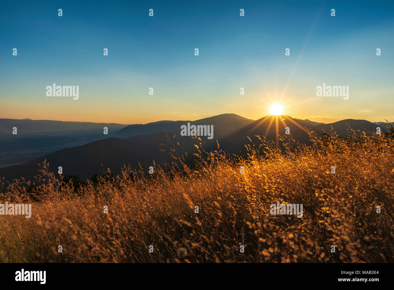 Mountain valley during sunrise. Natural summer landscape Stock Photo ...
