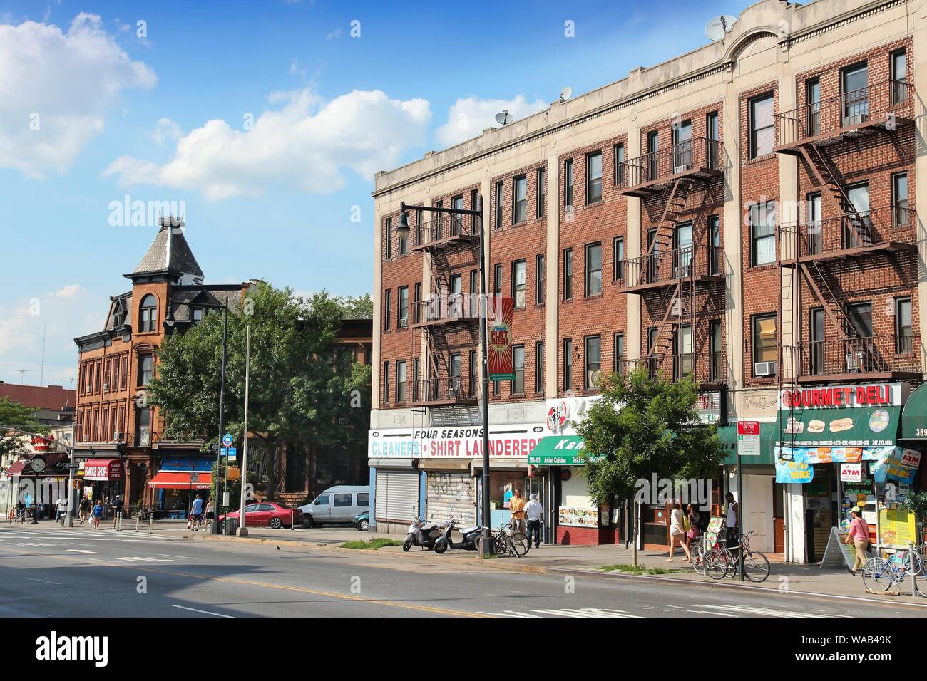 NEW YORK, USA - JULY 6, 2013: People walk in Prospect Heights, Brooklyn. New York City is visited by 56 million annual visitors (2014). 20 million peo Stock Photo