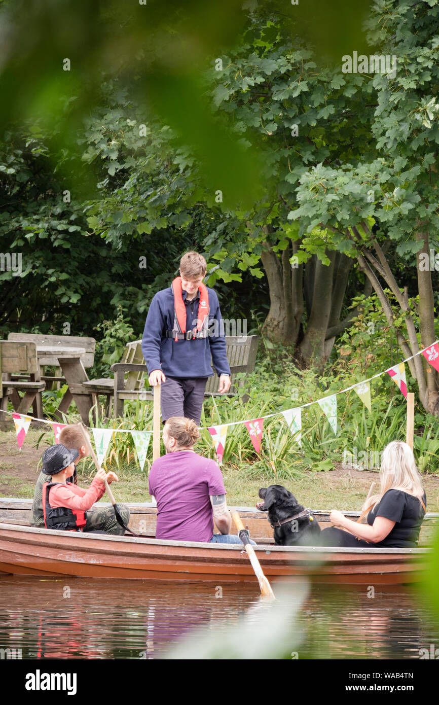 Visitors to Flatford Mill hire rowing boats to explore the River Stour