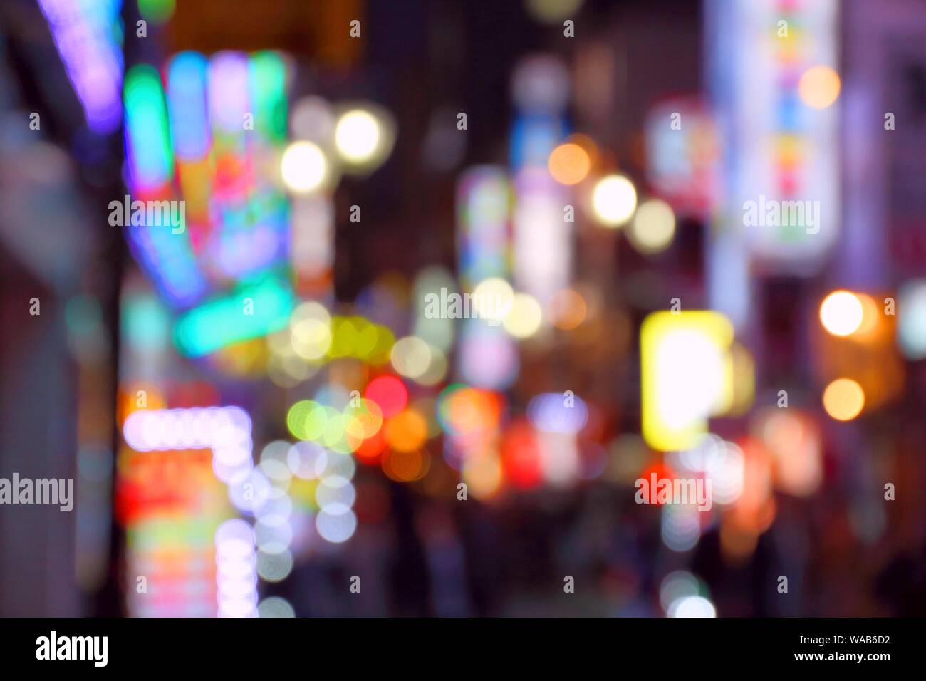Neon city night - Shinjuku ward, Tokyo. Defocused blurred city lights. Stock Photo