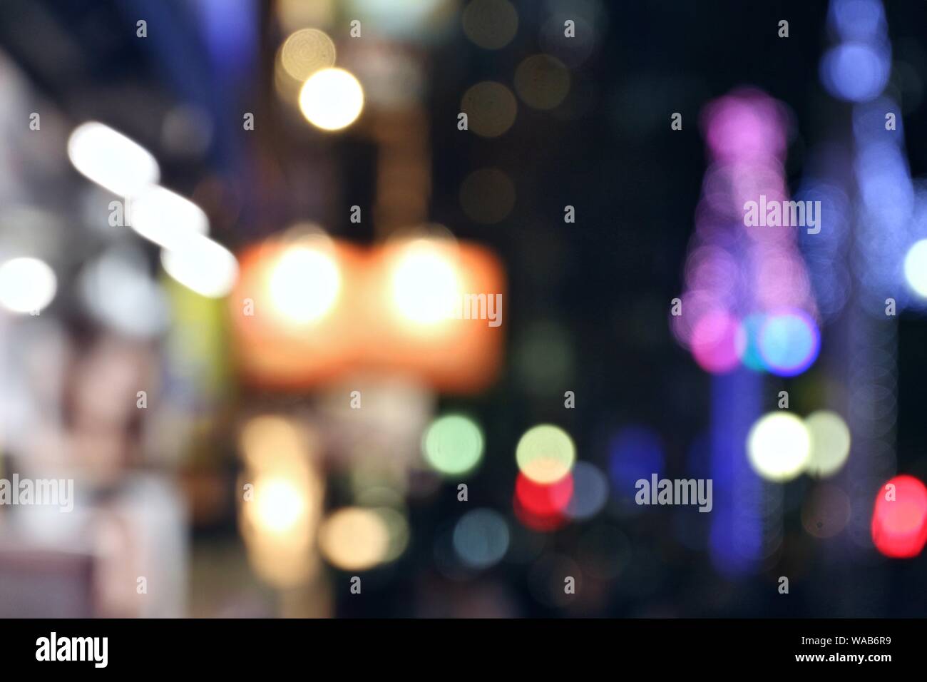Night city lights - defocused Tokyo, Japan. Blurred neons. Stock Photo