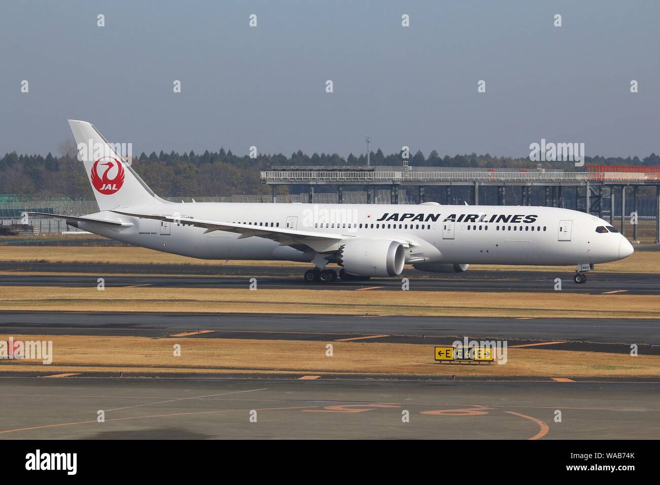 TOKYO, JAPAN - DECEMBER 5, 2016: Japan Airlines Boeing 787 taxiing at Narita Airport of Tokyo. The airport is the 2nd busiest airport of Japan (after Stock Photo