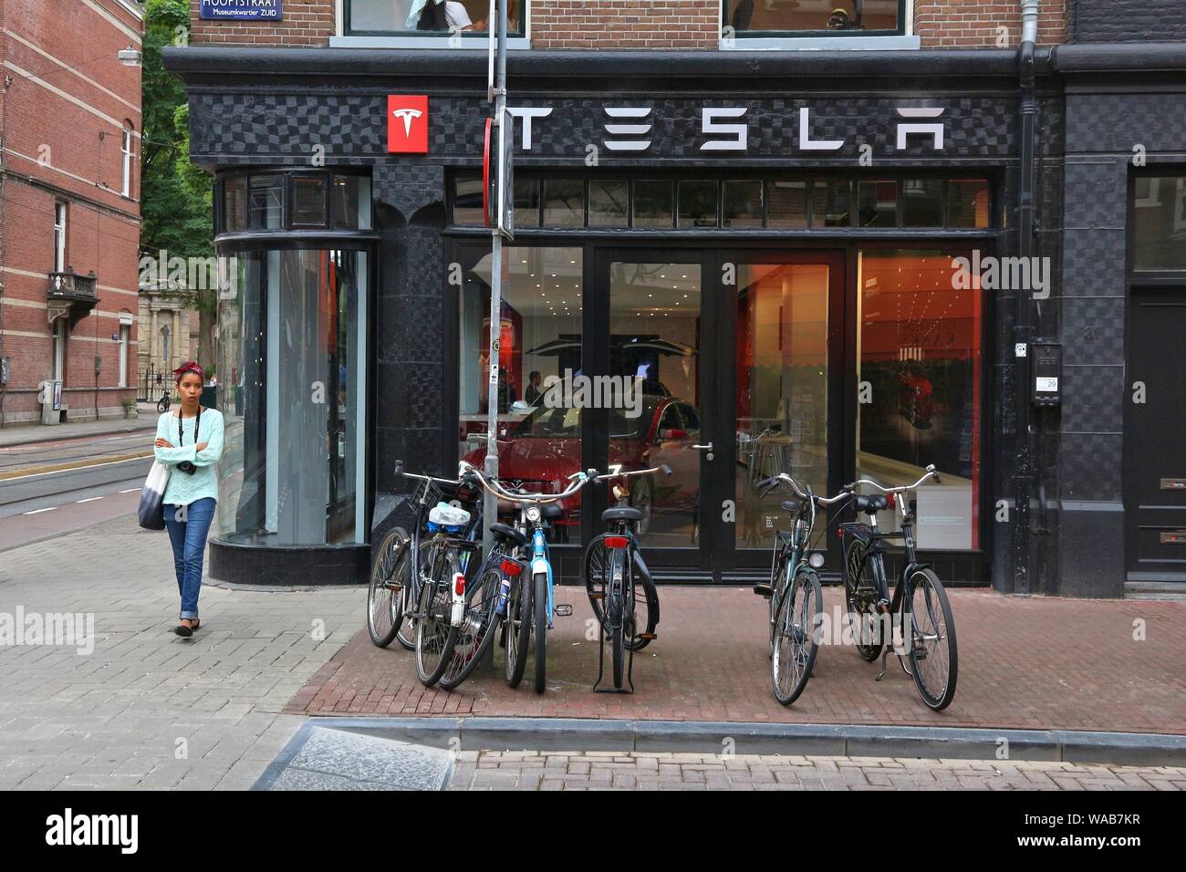 AMSTERDAM, NETHERLANDS JULY 10, 2017 People visit Tesla car