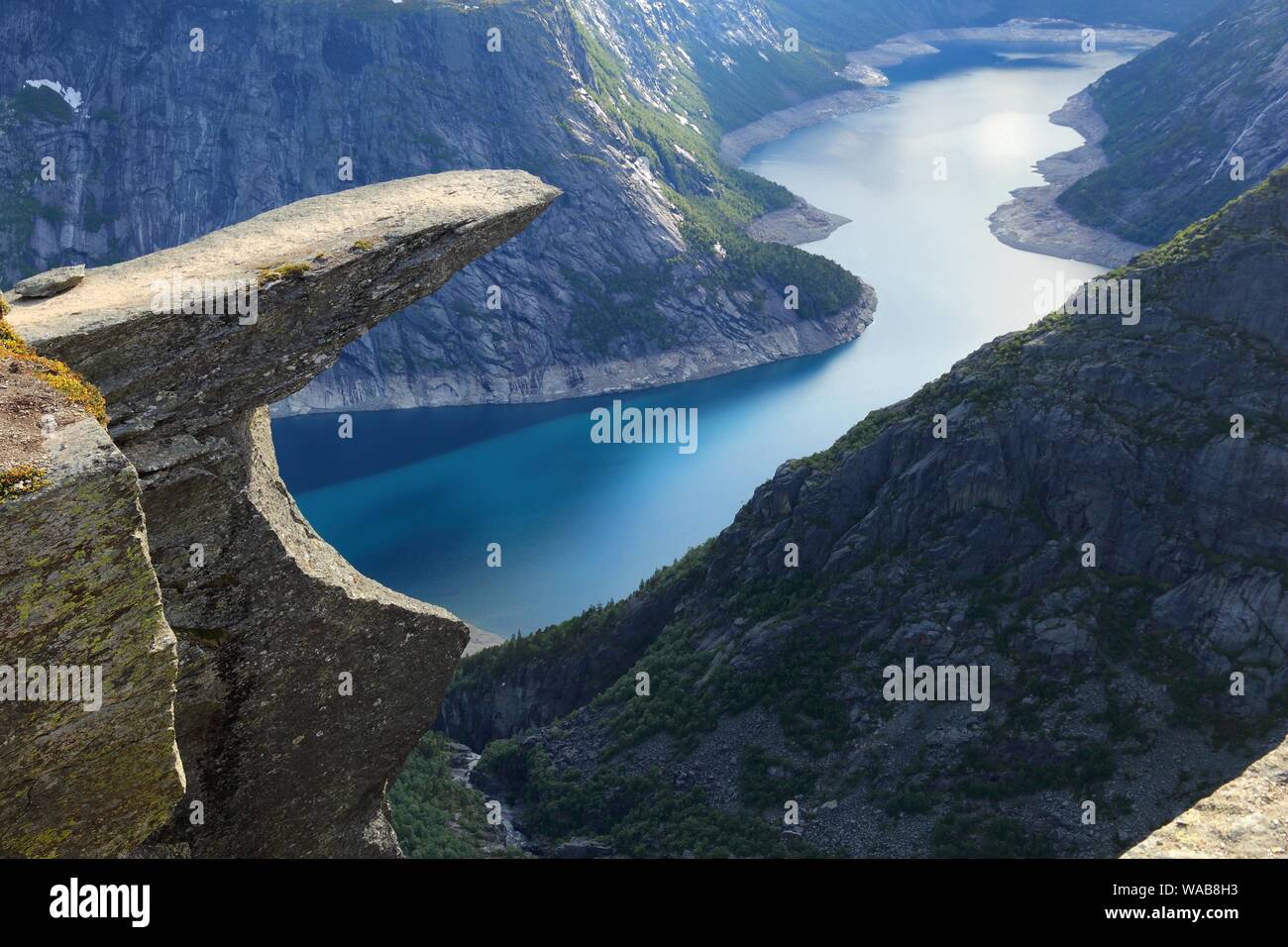 Troll's Tongue rock in Norway. Tourist attraction known as Trolltunga. Rock  pulpit over lake Stock Photo - Alamy