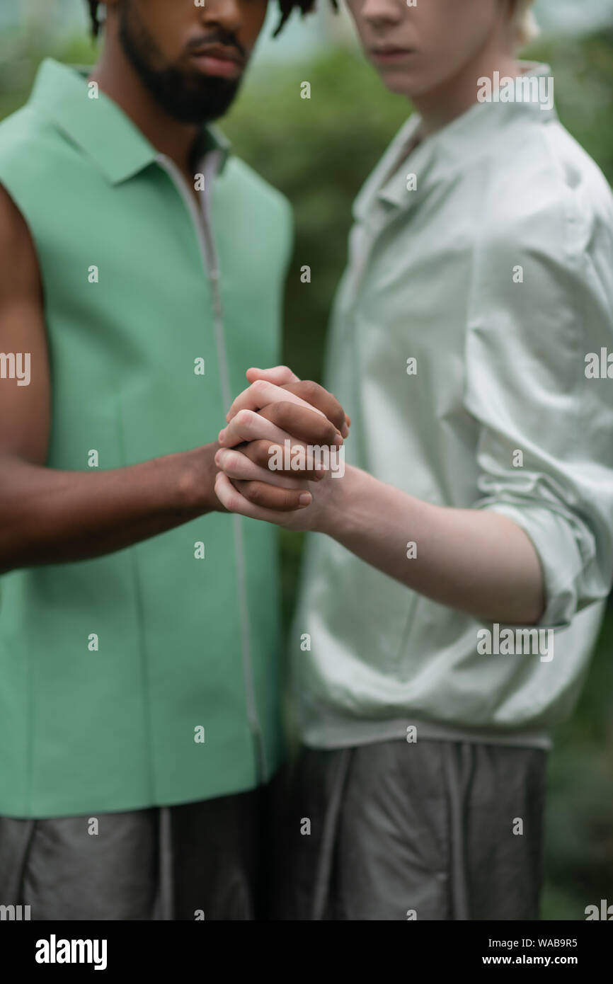 Two men participating in social campaign posing with hands Stock Photo