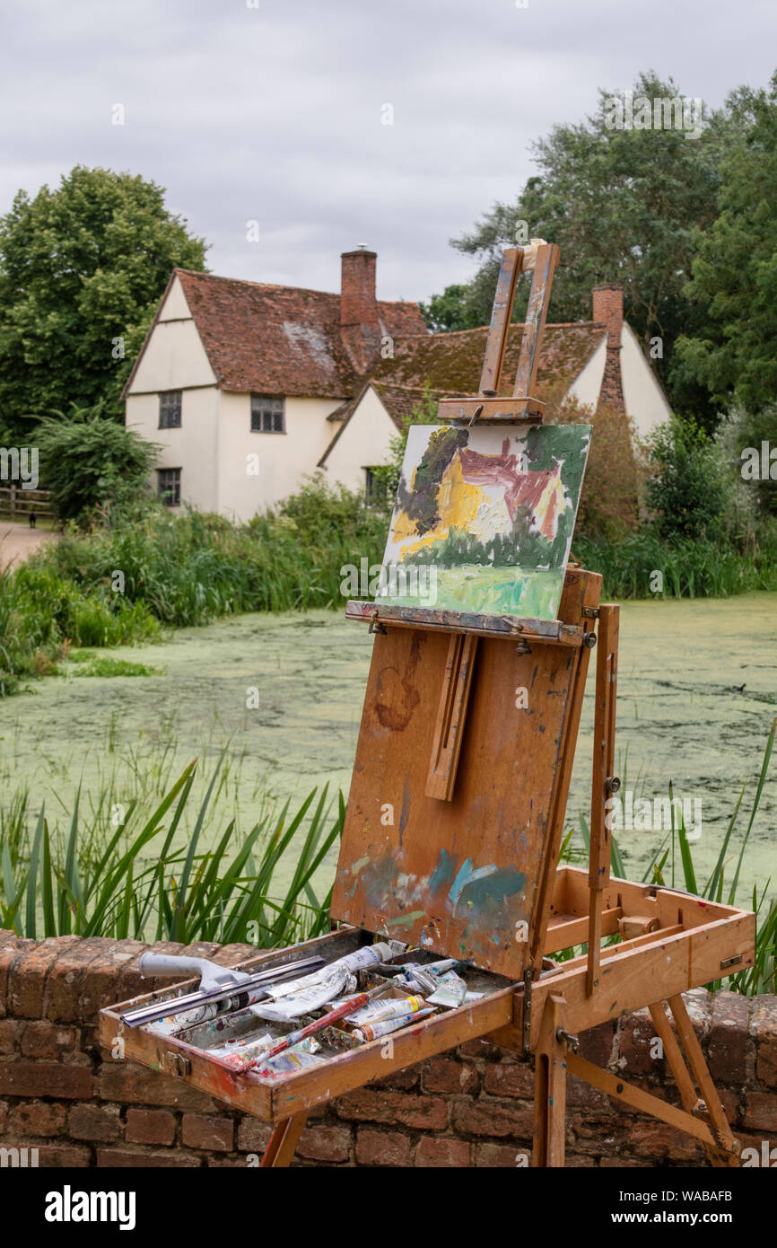 Artists painting Willy Lott's house at the National Trust's Flatford Mill made famous by the artist John Constable 1776 -1837,  Suffolk, England, UK Stock Photo