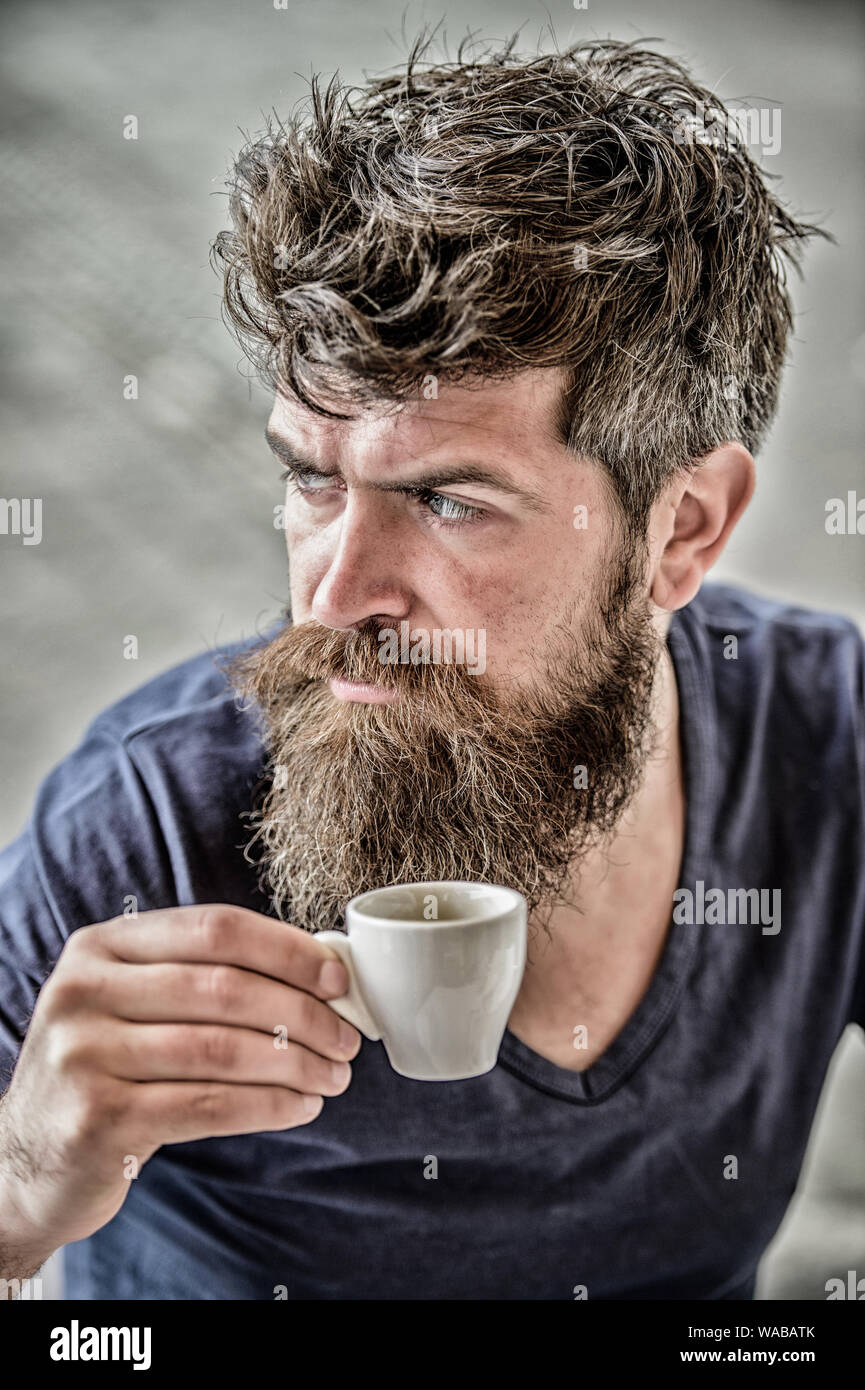 Enjoy hot drink. Hipster drinking fresh brewed coffee. Man with beard and  mustache and espresso cup. Bearded guy consume caffeine. Espresso arabica  only. Coffee break concept. Guy relaxing espresso Stock Photo -