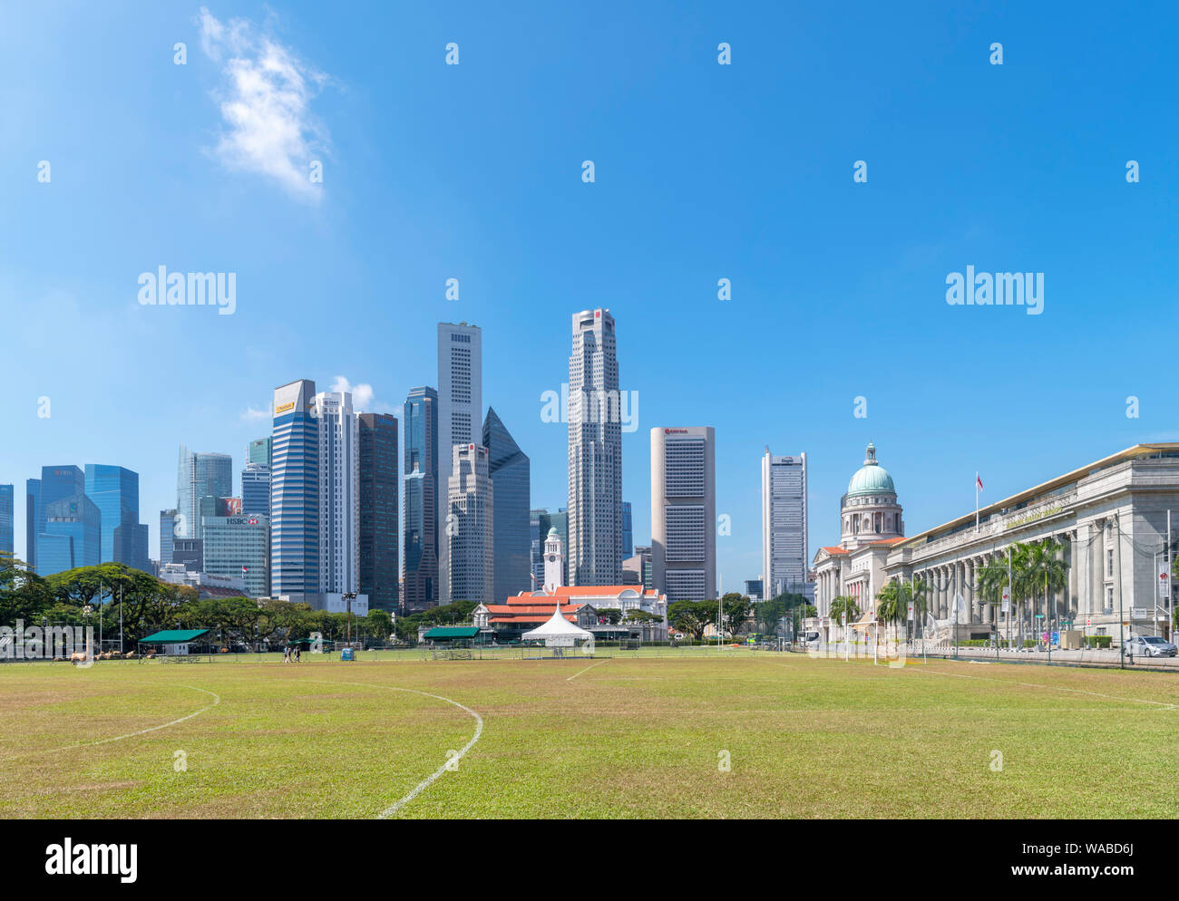 The downtown skyline and National Gallery of Singapore viewed from the Padang, a sports ground in the city centre, Singapore City, Singapore Stock Photo