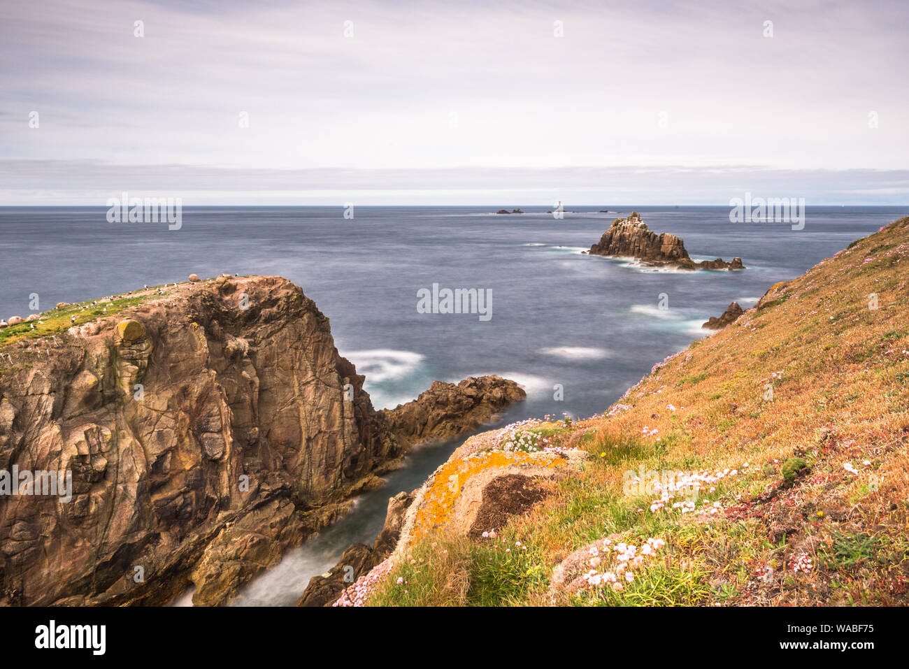 Enys Dodnan and the Armed Knight rock formations at Lands End, Cornwall, England, United Kingdom, Europe. Stock Photo