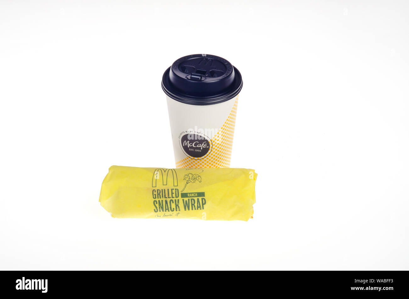 McDonald’s coffee cup with grilled ranch chicken snack wrap Stock Photo