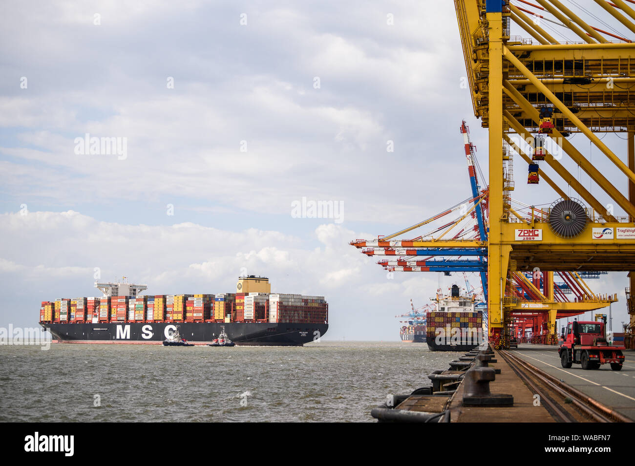 Bremerhaven, Germany. 19th Aug, 2019. The currently largest container ship in the world 'MSC Gülsün' is calling at the Bremerhaven container terminal for the first time. According to the Swiss shipping company Mediterranean Shipping Company (MSC), 'MSC Gülsün' can carry 23 756 standard containers (TEU), including 2000 refrigerated containers. Credit: Mohssen Assanimoghaddam/dpa/Alamy Live News Stock Photo