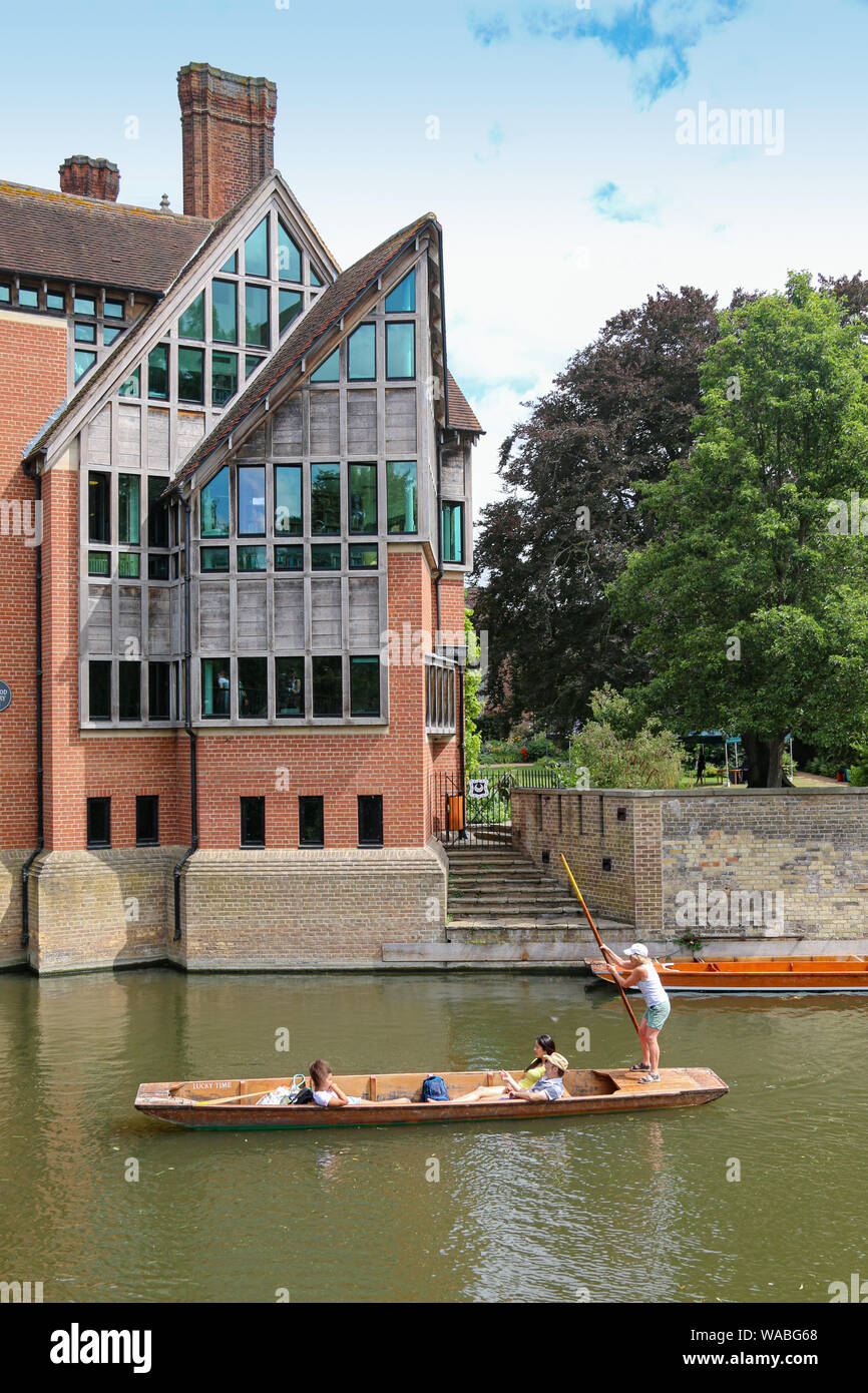 Punting on the River Cam, passing the Jerwood Library, Trinity Hall, Trinity College, Cambridge University, Cambridge, United Kingdom Stock Photo