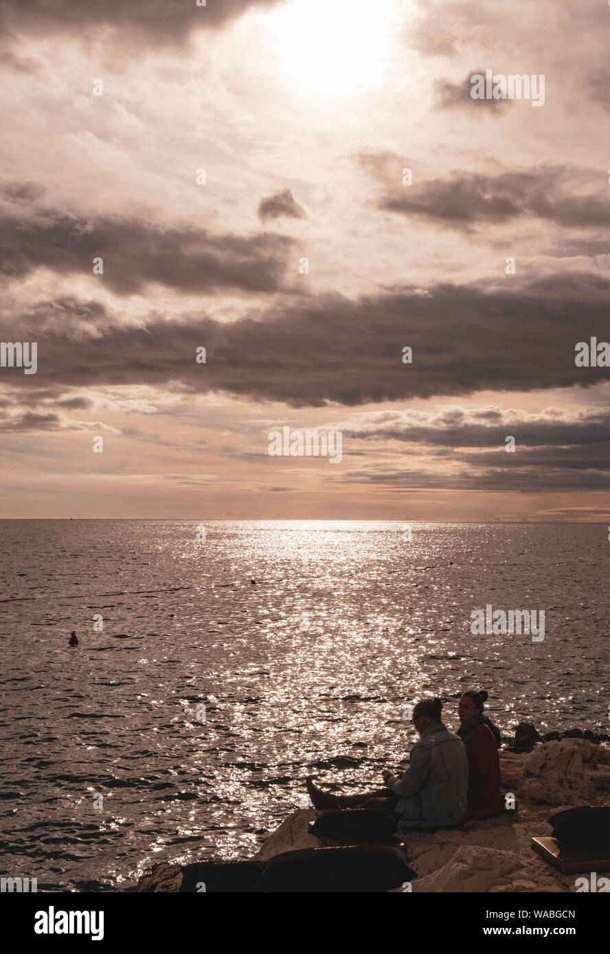 Rocky shore with sunset hi-res stock photography and images - Alamy