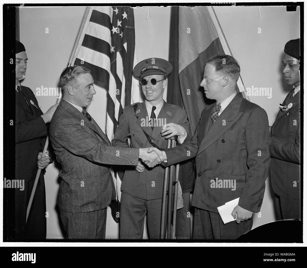 Communists get together. Washington, D.C., Feb. 12. Americans, all of whom fought and many wounded while fighting for the Loyalists in Spain, met today in Washington at the First National Conference of the Veterans of the Abraham Lincoln Brigade, left to right: Francis J. Gorman, President of the United Textile Workers of America; Lieut. Robert Raven, wounded and blinded in the Spanish War; and Commander Paul Burns of Boston Commander of the Lincoln Brigade, 2/12/38 Stock Photo