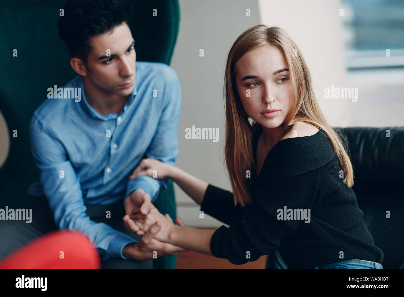 Consultation of couple young man and woman patient on reception for psychologist. Family problems Stock Photo