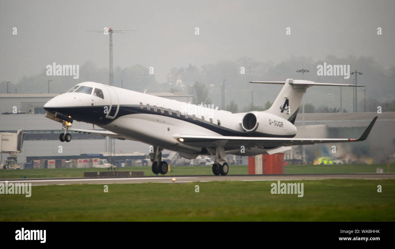 Glasgow, UK. 24 April 2019. Lord Alan Sugar's brand new aircraft, appropriately registered G-SUGR Embraer Legacy 650, executive transport private bixjet seen taking off at Glasgow International Airport. Colin Fisher/CDFIMAGES.COM Credit: Colin Fisher/Alamy Live News Stock Photo