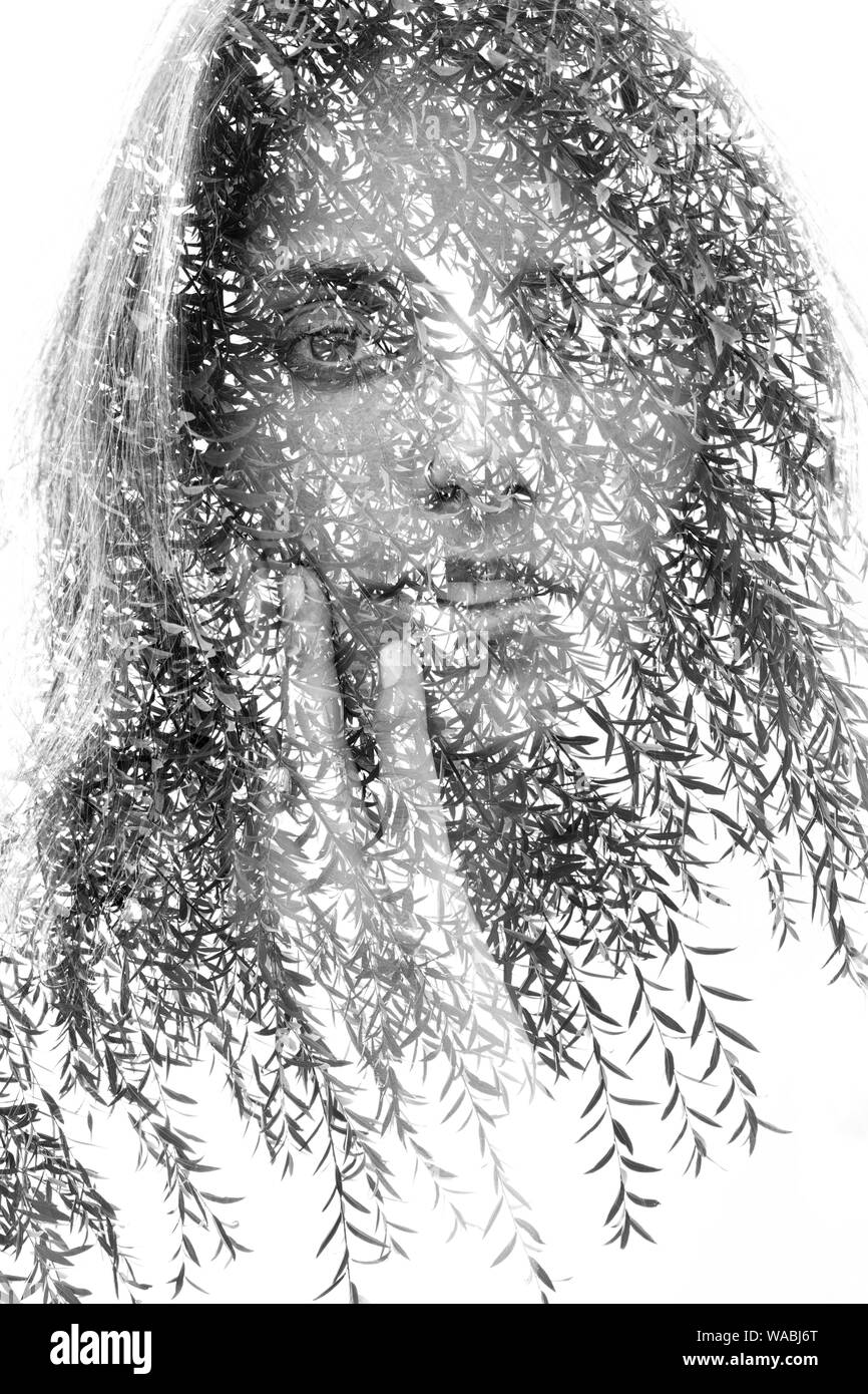 Double exposure portrait of a happy girl facing the camera and gently ...