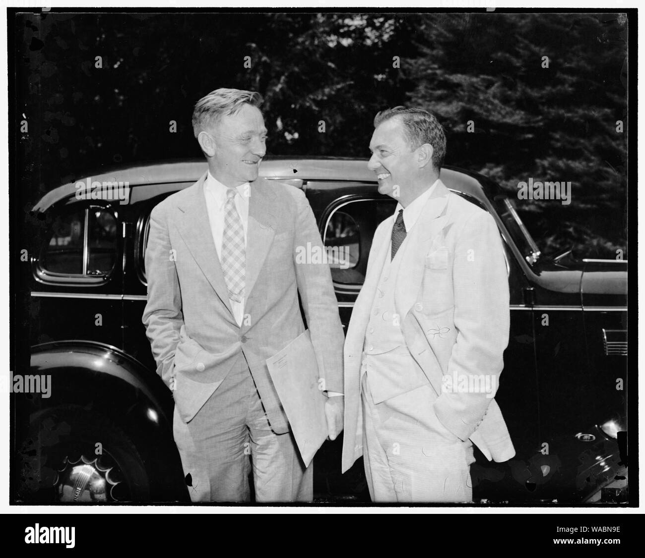 Confer with President on anti-trust matters. Washington, D.C., June 24. William O. Douglas, Chairman of the Securities and Exchange Commission. Left; and Robert Jackson, Solicitor General, photographed after leaving the White House today where they conferred with the President on anti-trust matters, preliminary to the government inquiry into monopolistic business practices, 6/24/38 Stock Photo