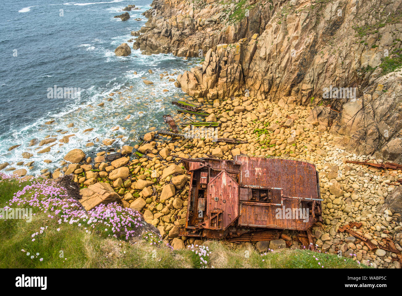 Wreckage of the shipwrecked ship the RMS Mulheim at the base of the cliffs at Castle Zawn near Land's End, Cornwall, England. UK. Stock Photo