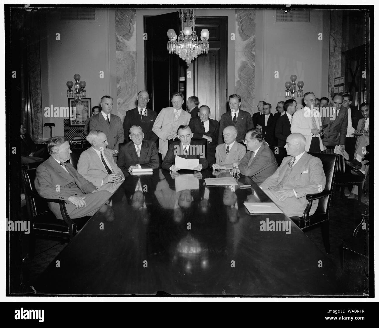Congressional monopoly committee holds initial meeting. Washington, D.C., July 1. The Congressional Executive Committee to investigate monopolies held their first meeting today and charted a course designed to determine the efffect of concentrated wealth and power on business. Pictured, left to right: (sitting) Senator William E. Borah, Herman Oliphant, General Counsel for Treasury; Senator William H. King, Utah; Senator Hoseph C. O'Mahoney, of Wyoming and Chairman of the Committee; Rep. Hatton W. Sumners, of Texas and Vice Chairman; Thurman Arnold, Assistant Attorney General; and Rep. Edward Stock Photo