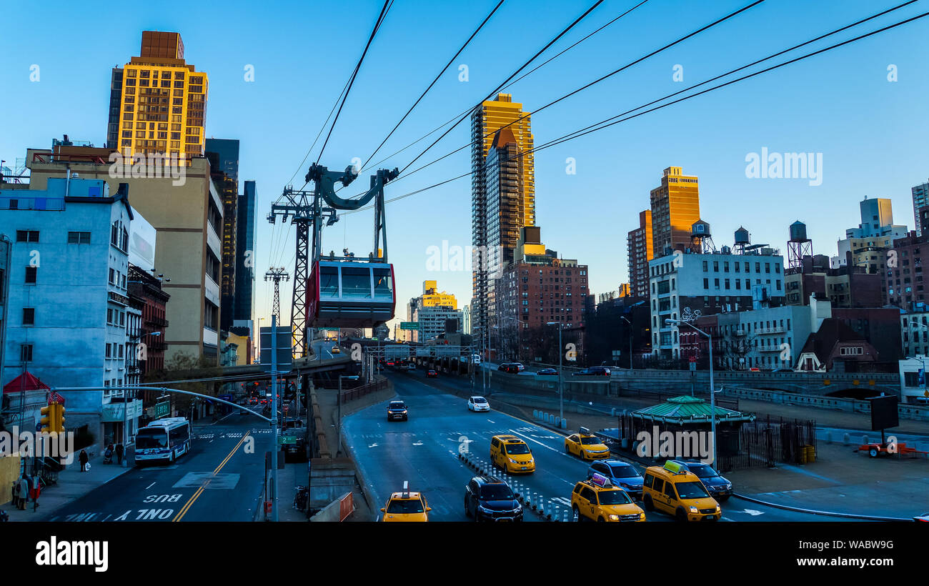 New York City, USA, January 1, 2015, Tram car of roosevelt island tramway connecting roosevelt island and upper east side of manhattan driving above s Stock Photo