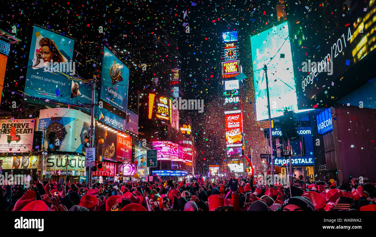 New York City, USA, January 1, 2015, Atmospheric new year's eve celebration on famous times square intersection after midnight with countless happy pe Stock Photo