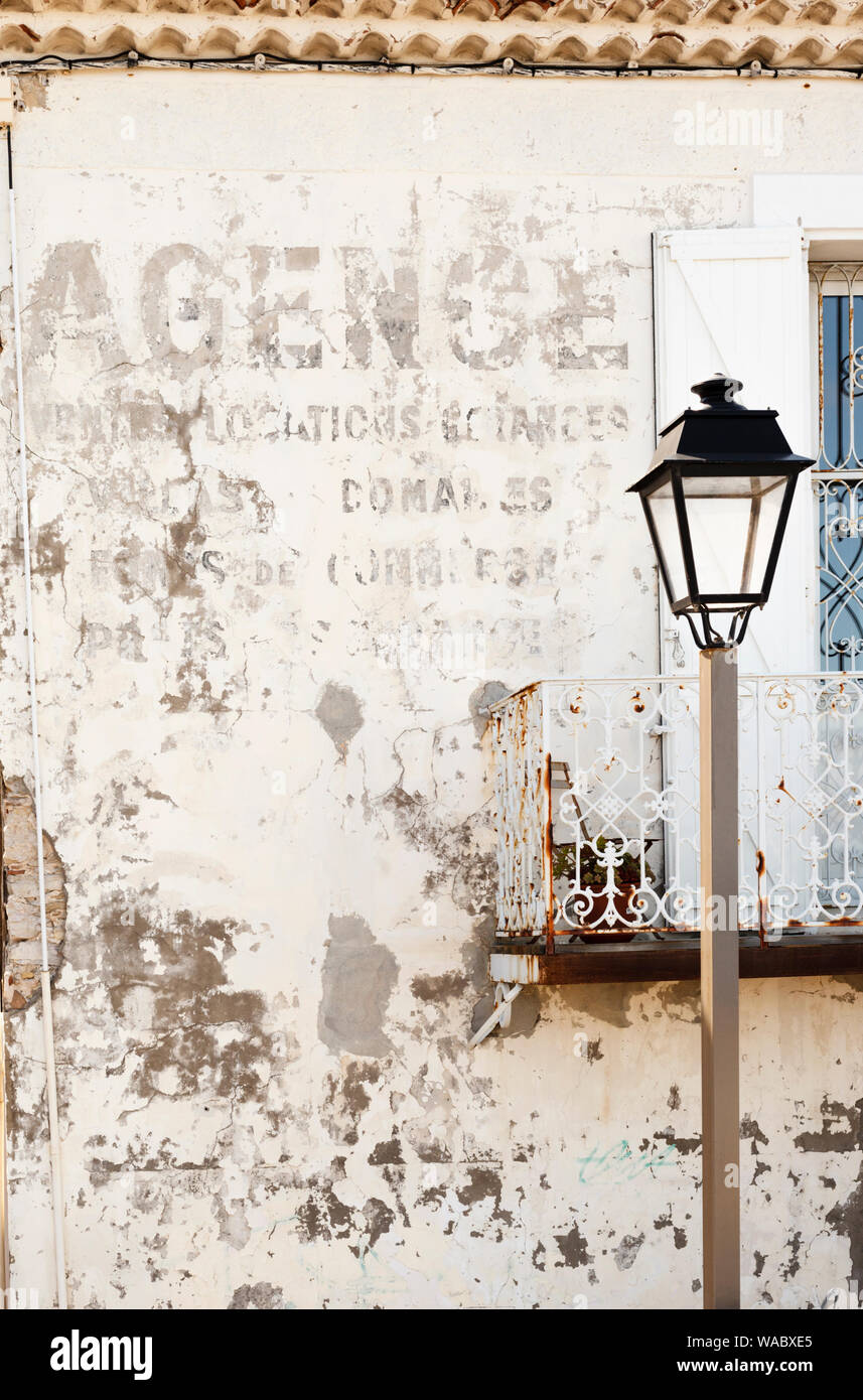 Fading lettering on a wall in Antibes Stock Photo