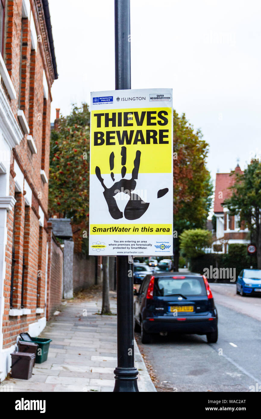 A notice in a residential street intended to deter crime by the Smartwater security company, Islington, London, UK Stock Photo