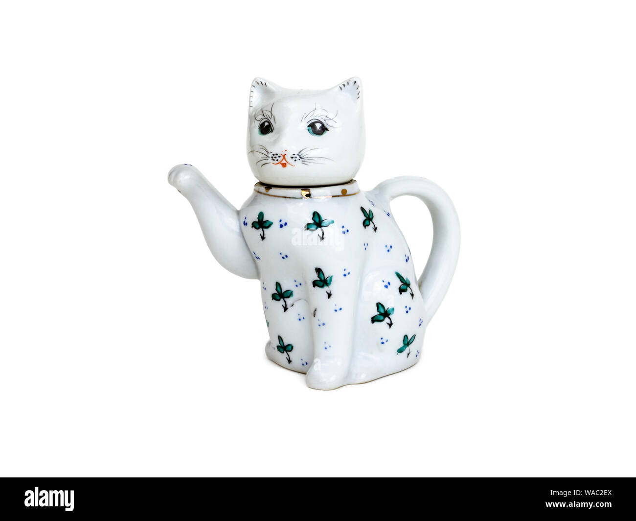A Chinese decorative teapot in the form of a cat, its head the lid, its tail the handle and its upraised paw the spout Stock Photo
