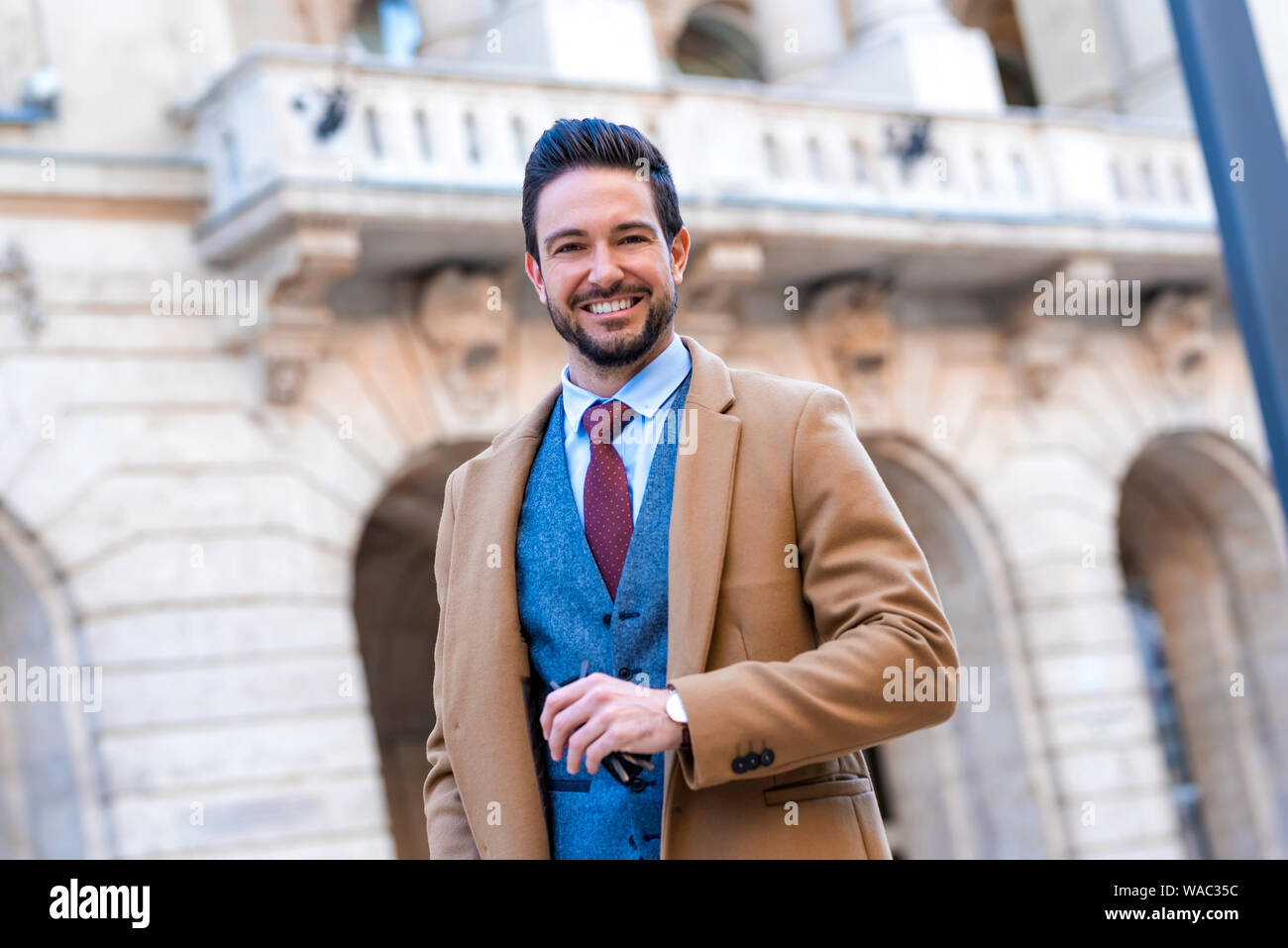 Handsome confident man in suit hi-res stock photography and images - Alamy