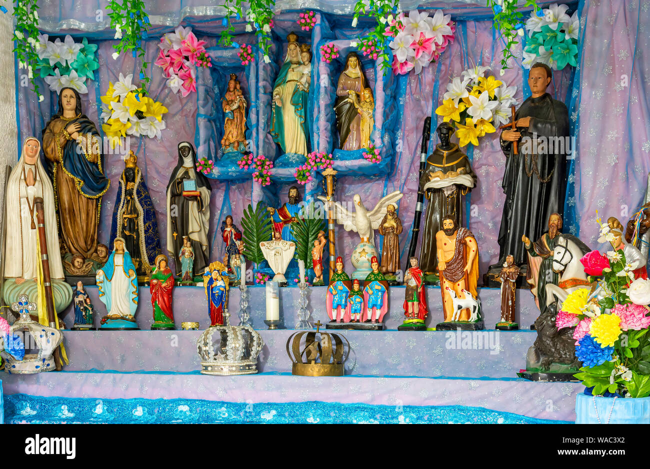 Brazilian religious altar mixing elements of umbanda, candomblé and catholicism in the syncretism present in the local culture and religion Stock Photo