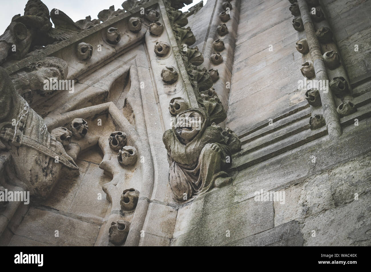 A close up of a carved stone figure and decoration on the tower of the University church of St Mary the Virgin, Oxford, England UK. Stock Photo