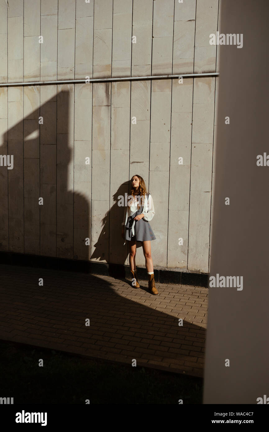 Woman in mini skirt sitting hi-res stock photography and images - Alamy