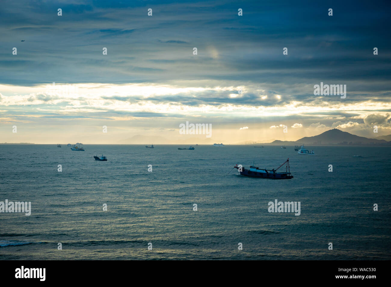 Fishing boat on sea at sunset hi-res stock photography and images - Alamy