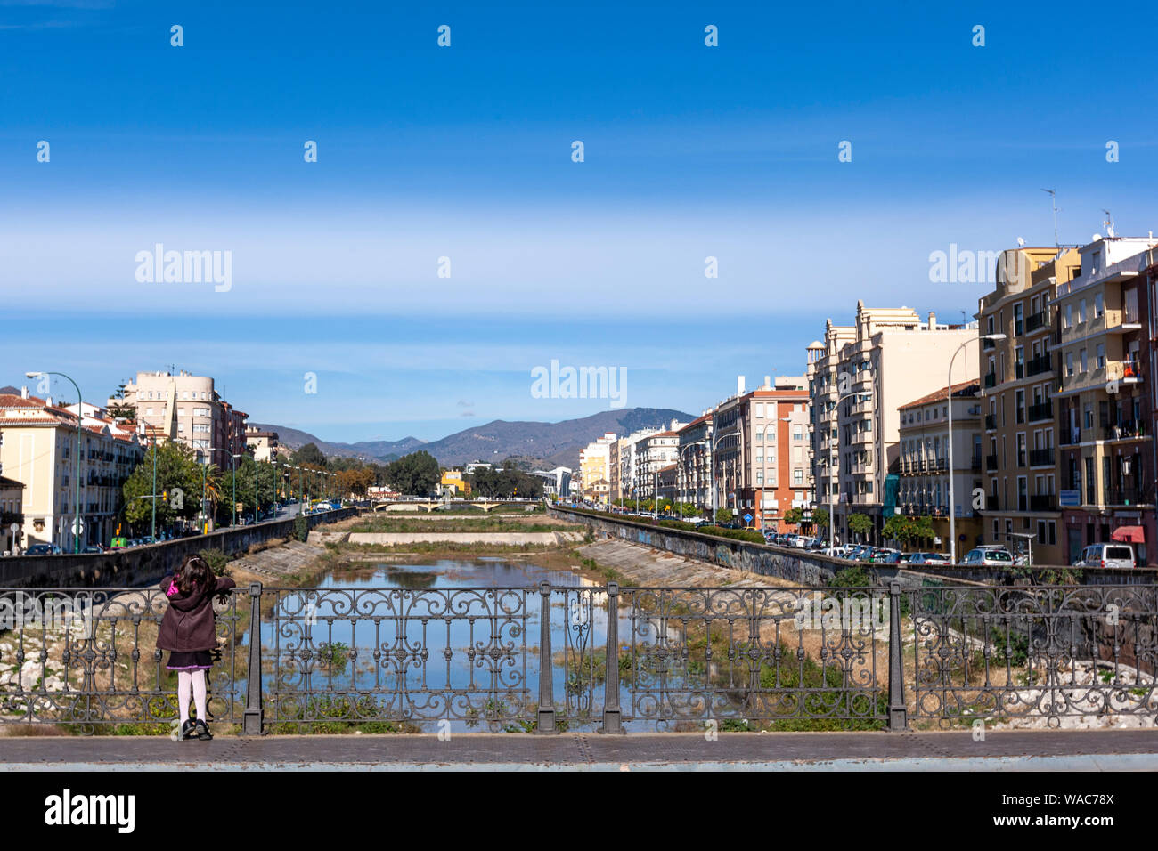 Girl looking the nearly empty River Guadalmedina, Malaga, Andalucia, Spain Stock Photo