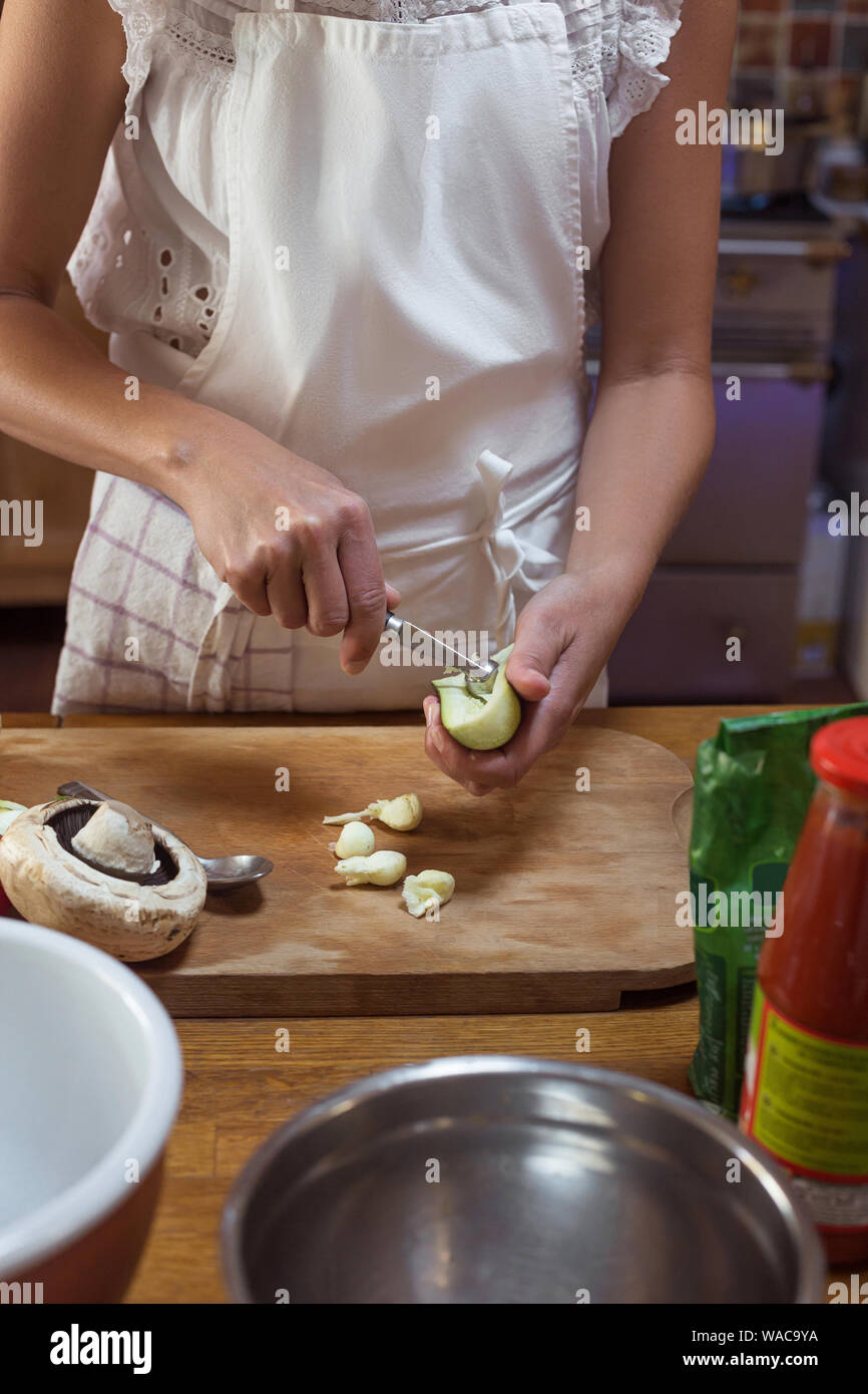 Process Of Cutting Vegetables On Wooden Board Aged Woman In White