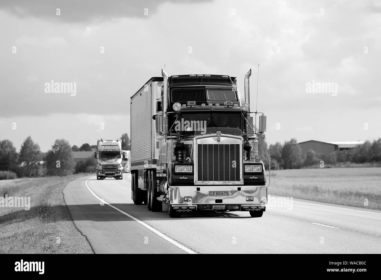 Luopajarvi, Finland. August 8, 2019.  Sundance Kid Saloon Kenworth W900 B year 1987 semi trailer in convoy to Power Truck Show 2019., black and white. Stock Photo