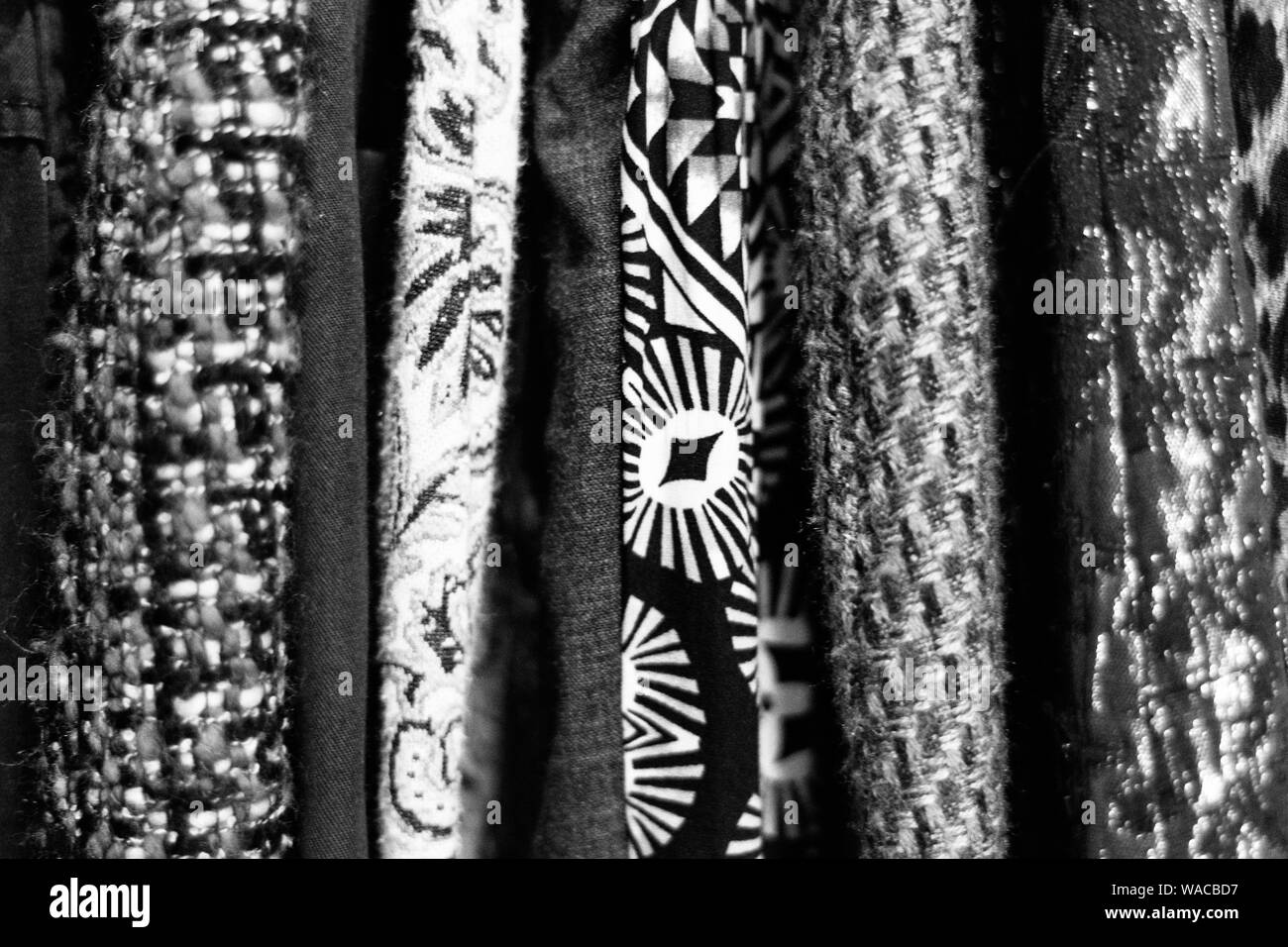 Sleeves of clothes hanging in a used clothing store make an abstract of texture, patterns and lines Stock Photo