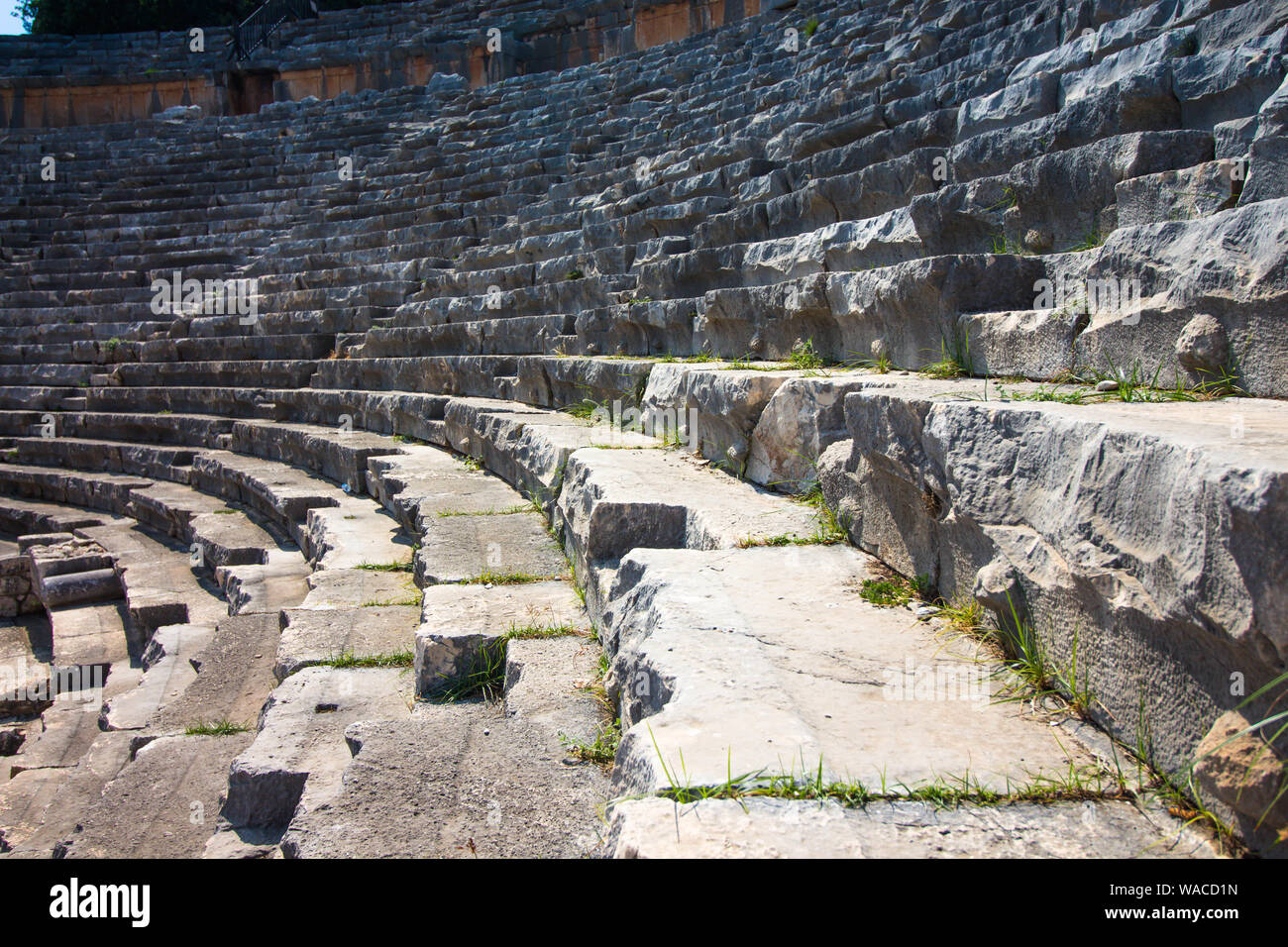 The ruins of an ancient amphitheater. The building was built by the ancient Romans in the territory of modern Turkey. Stock Photo