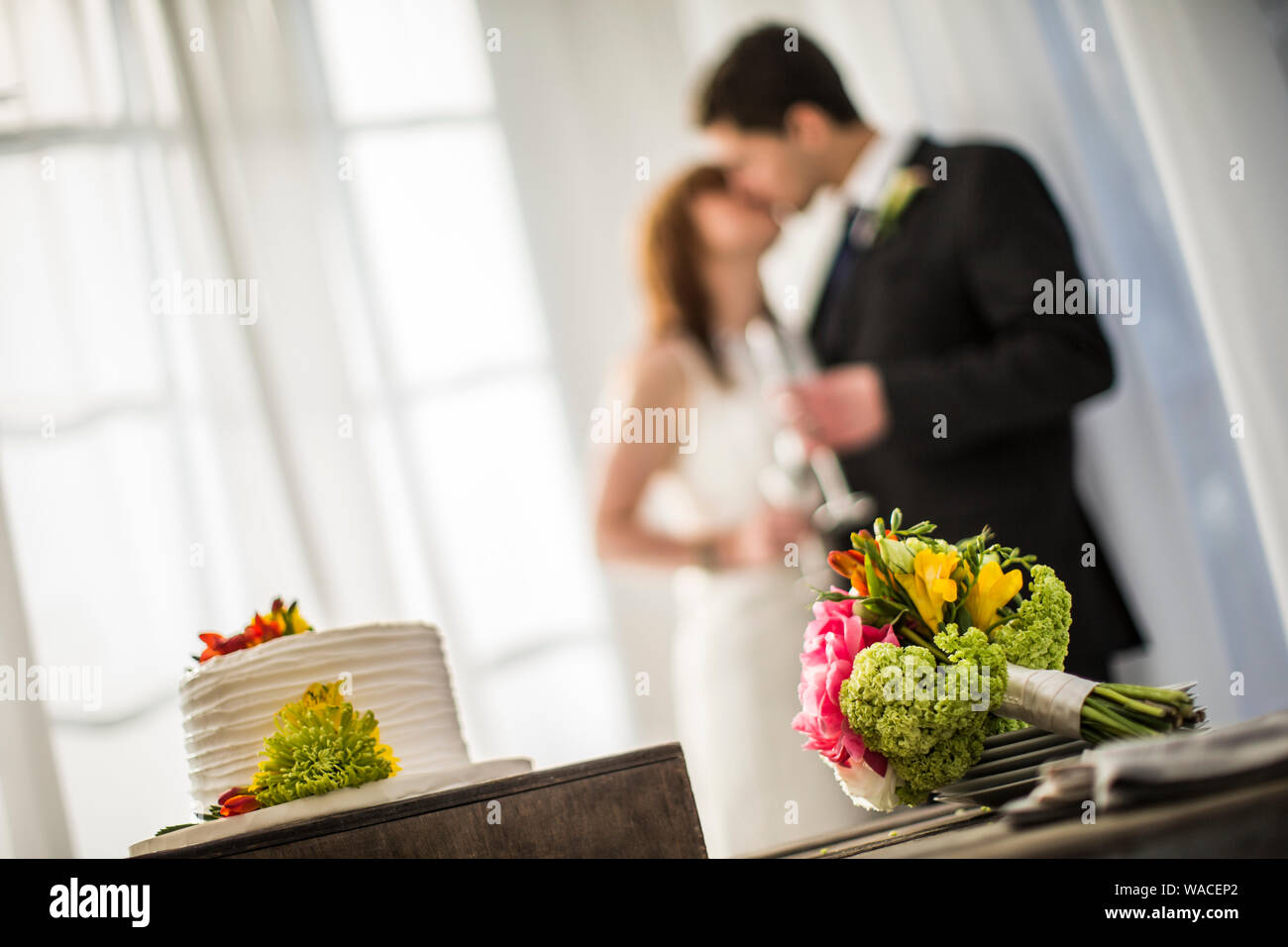 Bride and groom kissing at their wedding Stock Photo - Alamy