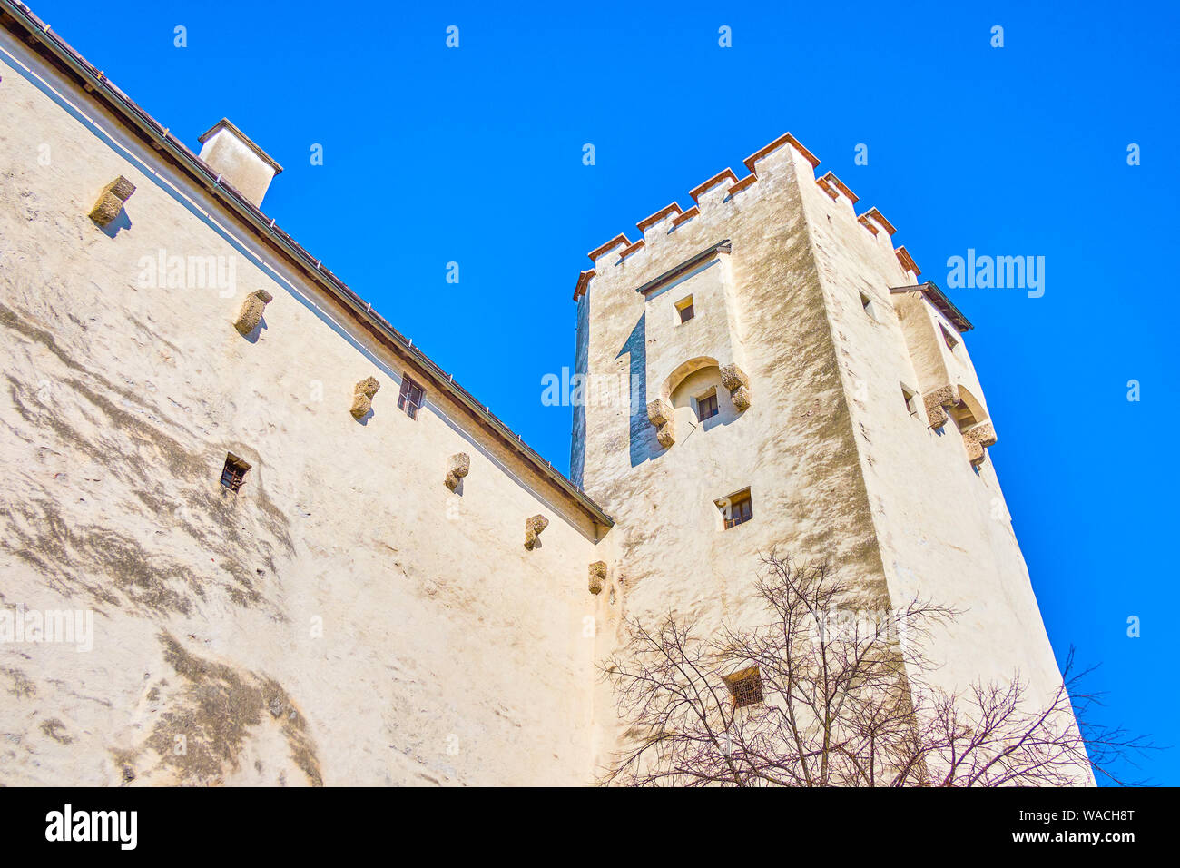 The high Geierturm (Vulture's tower) of Hohensalzburg Castle with defensive wall and small embrasures, Salzburg, Austria Stock Photo