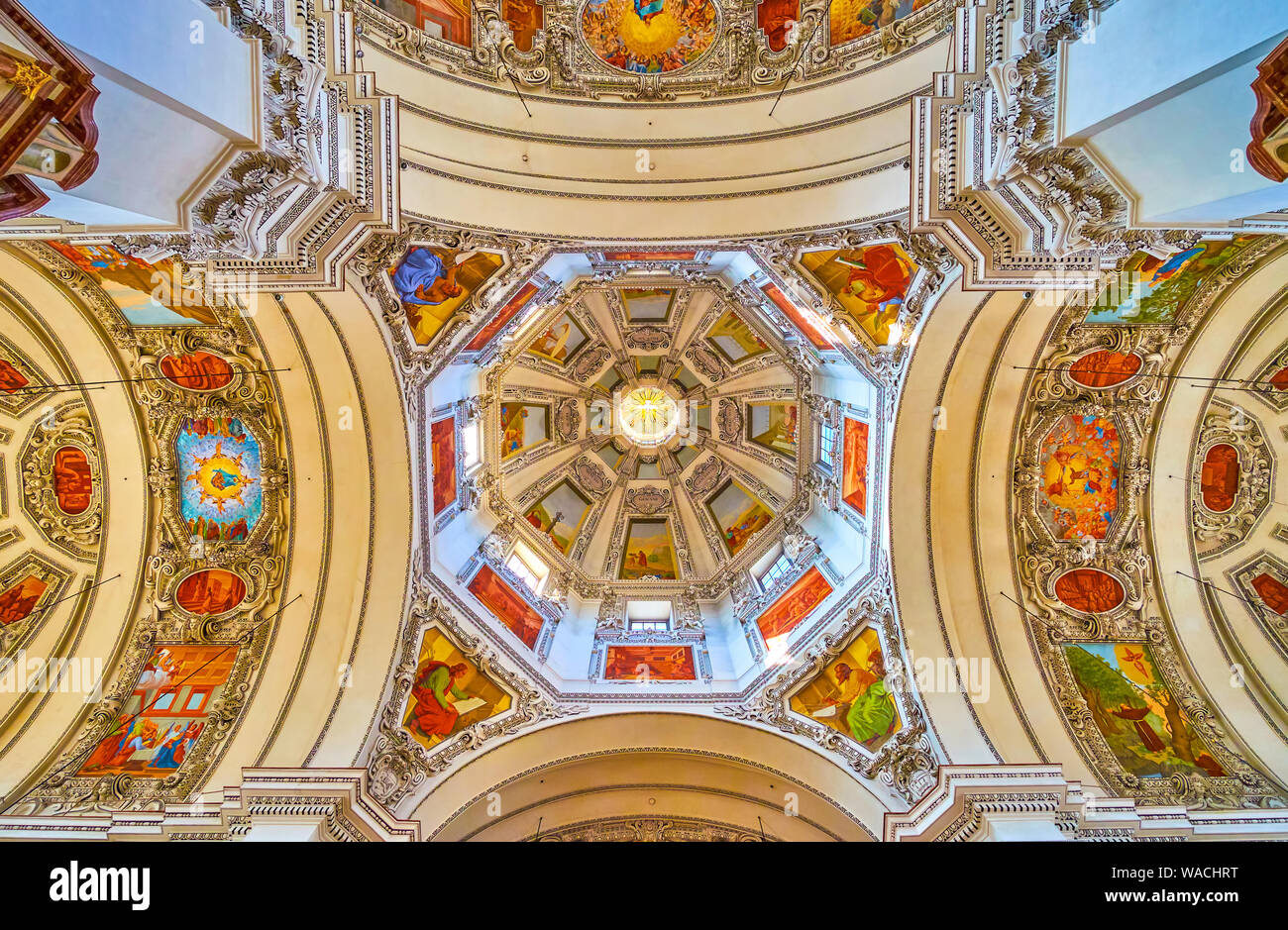 SALZBURG, AUSTRIA - FEBRUARY 27, 2019: The dome and the cruciform part of Salzburg Cathedral with extraordinary combination of colorful frescoes and w Stock Photo