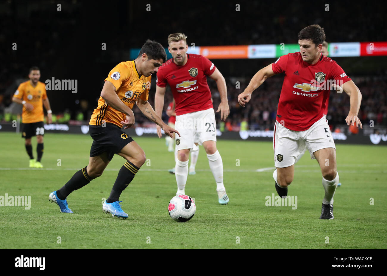 Woles' Lomba Pedro Neto and Manchester United's Harry Maguire (right) battle for the ball during the Premier League match at Molineux, Wolverhampton. Stock Photo
