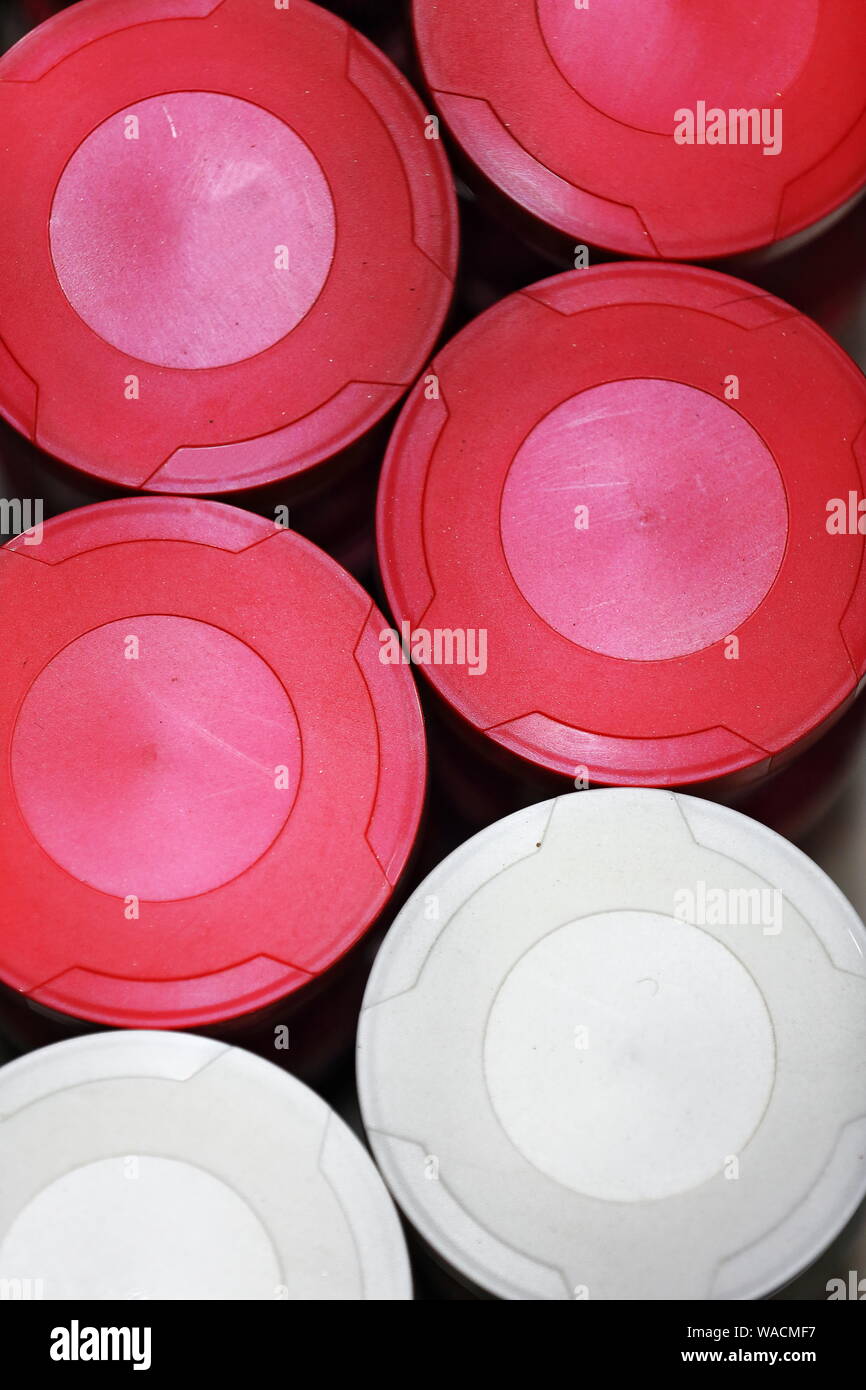 Red-white plastic containers put together. Shop in Ruoqiang-Charkhlik town-Xinjiang-China-0414 Stock Photo