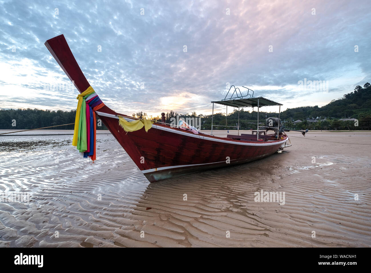 Dusk and a long-tail boat, Phuket Stock Photo